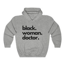 Load image into Gallery viewer, Black Woman Doctor Heavy Blend™ Hooded Sweatshirt
